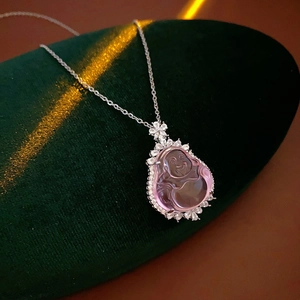 Macro view of purple resin Buddha pendant necklace with sparkling zircon flower detail