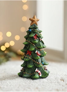 Detailed close-up of a resin mini Christmas tree with a golden star and red bows