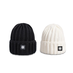 Winter rib-knit beanie hats for women in black and white with snowflake patch design