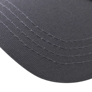 Detailed macro view of dark grey baseball cap brim with four parallel reinforced stitches