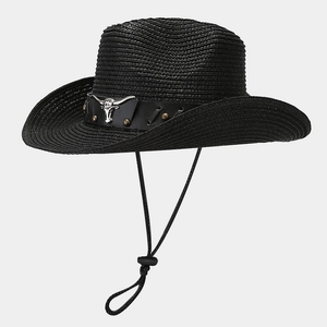 Detail of black straw cowboy hat featuring silver bull head metal and leather band