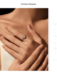 Close-up of hexagonal emerald-cut ring with shimmering side diamonds on a model's hand