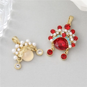 Detailed close-up of Chinese style butterfly earrings with red zircon and cat's eye stone