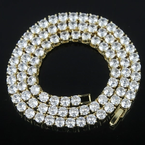 Macro detail of 5mm gold tennis chain featuring brilliant round-cut clear zircon stones