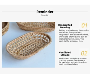 Detailed close-up of a handmade oval rattan storage tray with woven mesh side walls