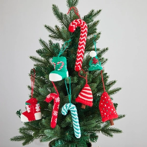 Knitted Christmas tree hanging ornaments set featuring mini socks and candy canes