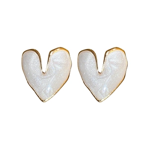 Minimalist pearl white heart stud earrings with elegant gold trim for a stylish look