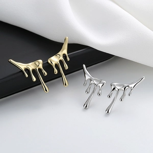 Minimalist 18K gold and silver molten metal stud earrings with lava drip design