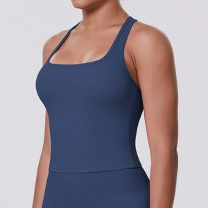 Detail of navy blue racerback sports bra showing supportive fabric and tight fit