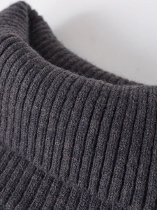 Close-up of the ribbed knit turtleneck collar on a dark grey short sleeve top