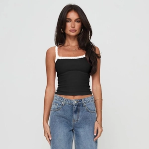 Detailed view of the delicate white lace trim on the black slim fit camisole top