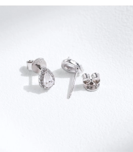 Macro shot of S925 sterling silver stamp on pear-shaped moissanite stud earrings