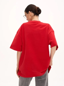 Back view of red oversized 100% cotton T-shirt with drop shoulder and trendy fit