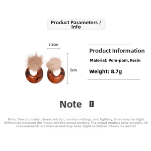 Detail showing dimensions of amber resin hoop earrings with fuzzy pom poms for women