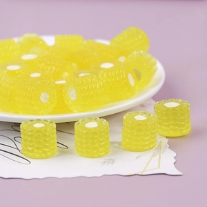 Close-up of mini resin corn miniature figurines for DIY crafts and micro landscape decor