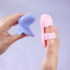 Mini silicone finger facial brush for pore cleansing and makeup removal in blue and pink