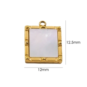 Close-up of square gold pendant with mother-of-pearl inlay measuring 12x12.5mm