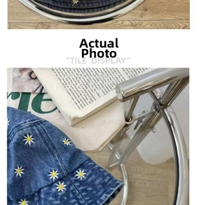 Detail of white daisy embroidery on dark blue washed denim bucket hat for sun protection