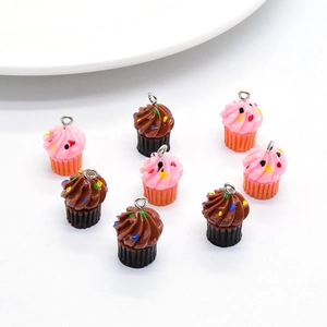 Top view of eight resin cupcake charms in pink and chocolate for DIY jewelry making
