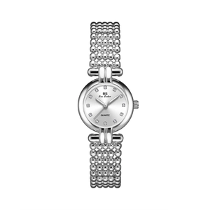 Detailed macro of silver quartz watch with round dial and beaded metal bracelet band