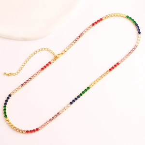 Detailed macro view of rainbow cubic zirconia stones on a gold-plated necklace chain