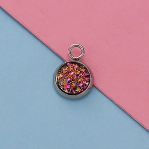 Detailed macro view of a 12mm stainless steel pendant tray with colorful glitter inlay