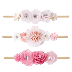 Three-piece set of pink and white floral baby headbands with pearls and elastic nylon band