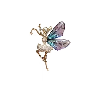 Exquisite gold dancing fairy brooch with cubic zirconia and blue purple gradient wings