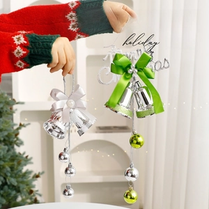 Christmas bell ornaments with satin bows and metallic spheres for tree decoration