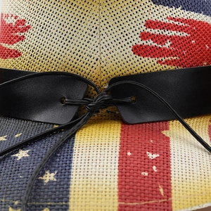 Macro shot of American flag cowboy hat showing straw texture and red palm print detail