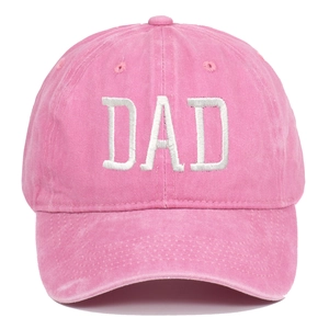 Close-up of pink washed cotton baseball cap featuring white DAD embroidery and texture