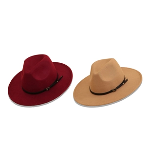 Classic burgundy and camel wool fedora hats with leather belt buckle decor on white background