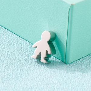 Polished silver stainless steel boy figure pendant displayed on a turquoise box