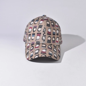 Close-up of khaki baseball cap featuring playful cartoon character patterns and stitching