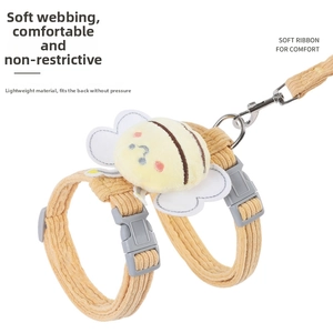 Detail of yellow corduroy pet harness featuring 3D bee doll and soft ribbon texture