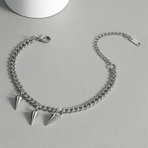 Detail of 316L stainless steel punk bracelet with silver conical spike charms