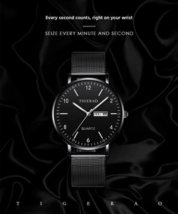 Close-up of quartz watch with black dial and Milanese mesh strap on silk fabric