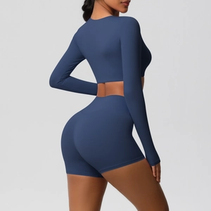 Side-back view of navy blue fitness set with long sleeve crop top and high waist shorts