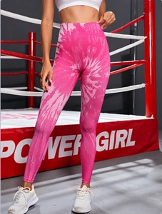 Detail of high waisted seamless yoga leggings with pink marble tie-dye pattern on model