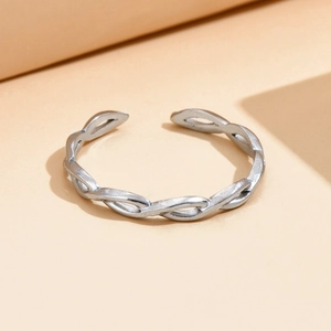 Minimalist silver braided stainless steel open ring with a twisted hollow texture design