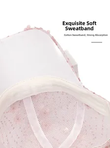 Detail view of pink mesh baseball cap featuring breathable cotton sweatband and sequins