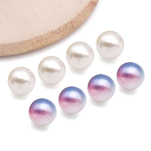 Detail of high-quality white and blue-purple gradient mermaid pearls for DIY jewelry