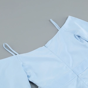 Detail of light blue dress showing off-shoulder neckline and invisible zipper closure