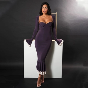 Detail of dark purple bodycon dress with white ruffle trim and fishtail hemline