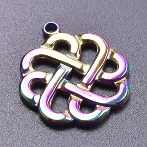 Macro shot of iridescent stainless steel witch knot pendant with vacuum plating finish