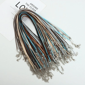 Close-up of multicolored wax cord necklaces with lobster clasps and extension chains