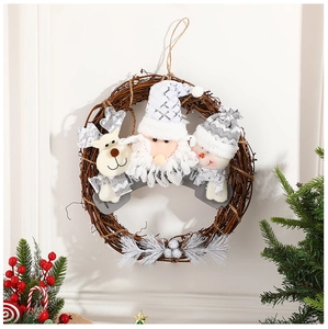 Detail of Christmas rattan wreath featuring Santa, reindeer and snowman plush dolls