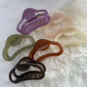 Assorted jelly colors large hollow hair claw clips in purple, pink, and green hues