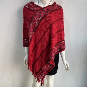 Detailed close-up of ethnic style knit shawl featuring diamond pattern and fringe tassels