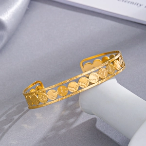 Modern 14K gold plated stainless steel triple-layer open bangle with textured discs